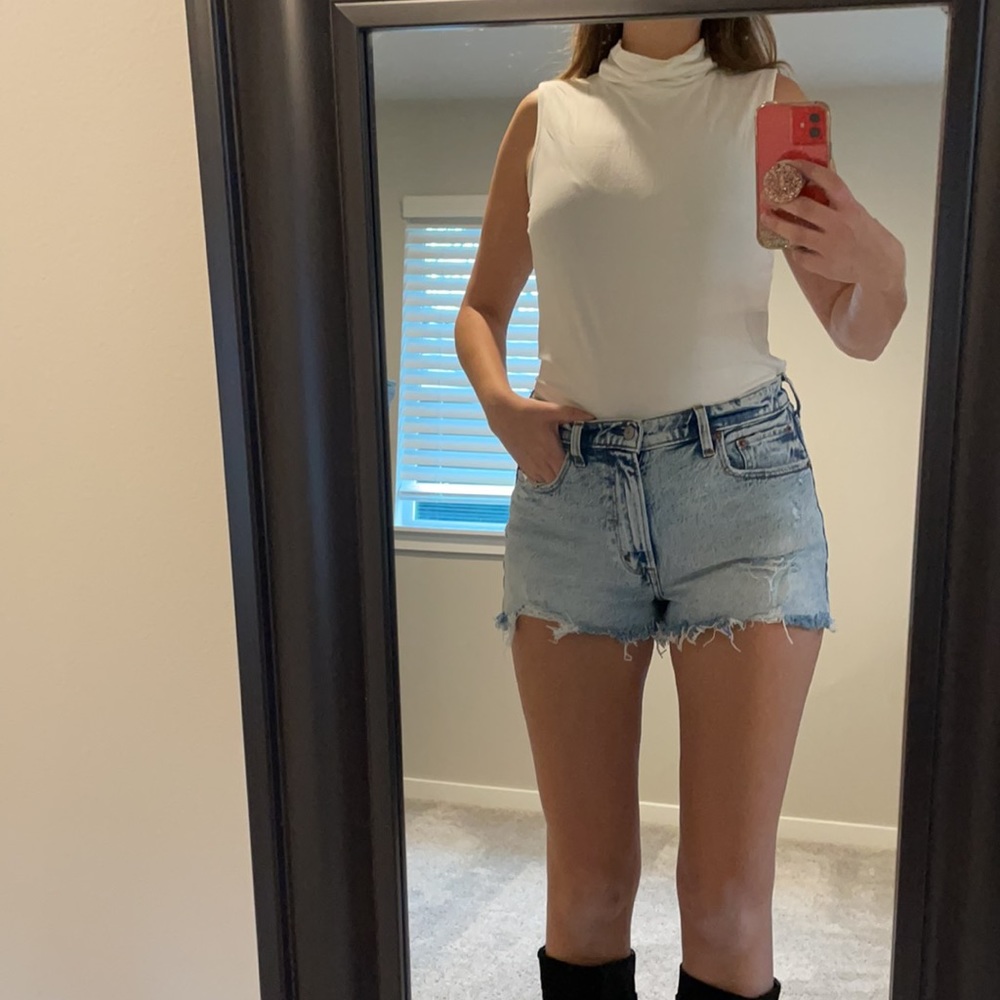 White sleeveless turtleneck